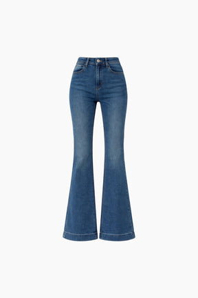 Blue flared jeans on a white background