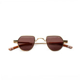 Sunglasses with gold frame and brown lenses , white stripped arms