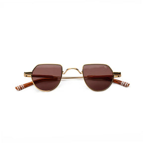 Sunglasses with gold frame and brown lenses , white stripped arms