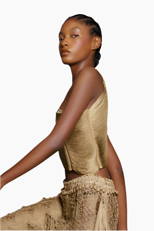 Woman wearing a beige outfit with a textured 