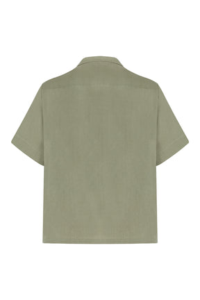 Green short-sleeve shirt on a white background