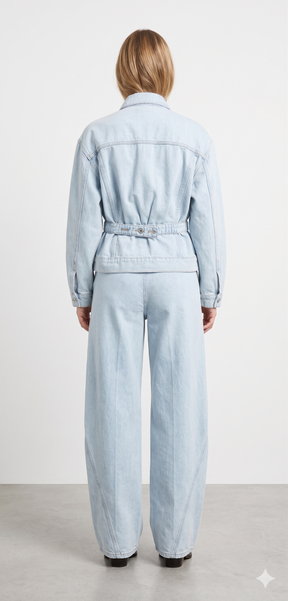 Light blue denim jumpsuit worn by a person on a white background