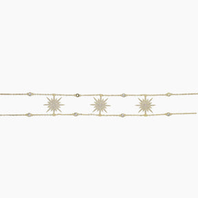 Gold bracelet with star-shaped charms on a white background