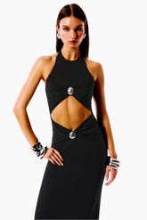 Woman wearing a black evening gown with cut-out design
