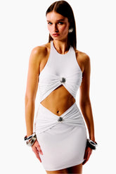 Woman wearing a white dress with cut-out design