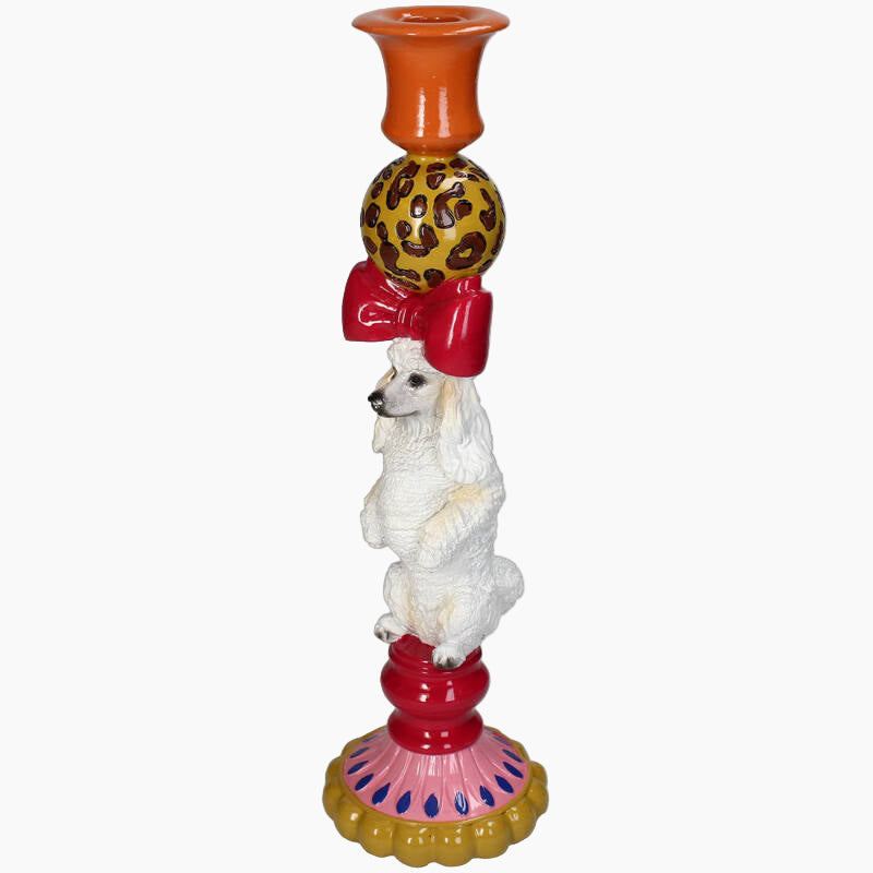 Decorative candle holder with a white dog figurine 