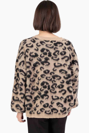 Person wearing a leopard print sweater 