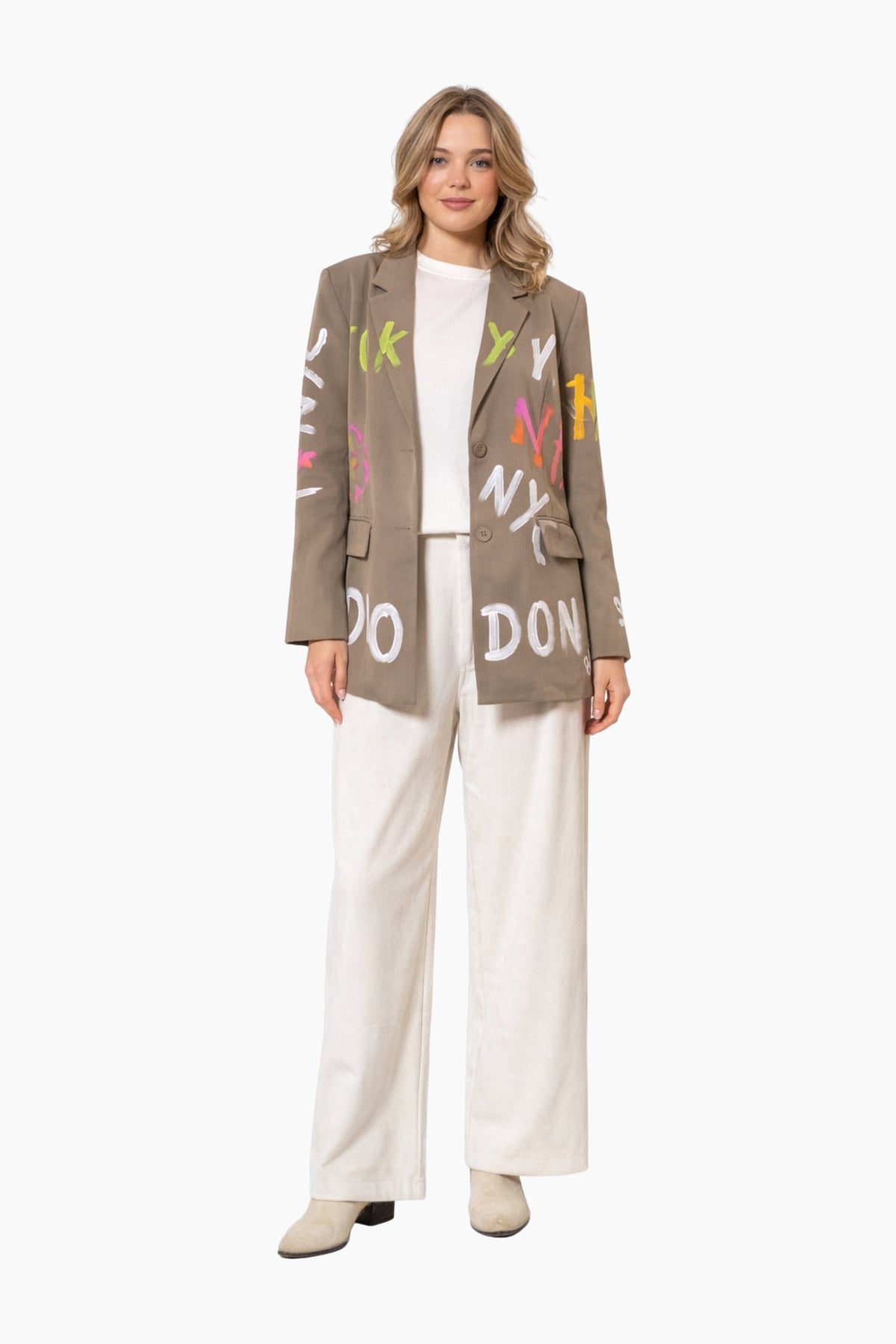 Woman wearing a jacket with colorful text design on a white background