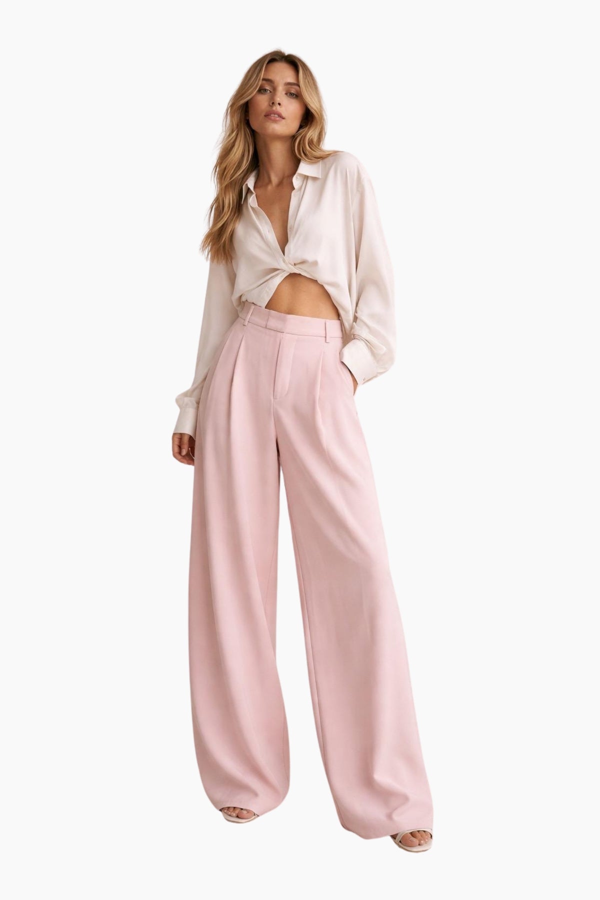 Woman wearing a white blouse and pink pants on a white background