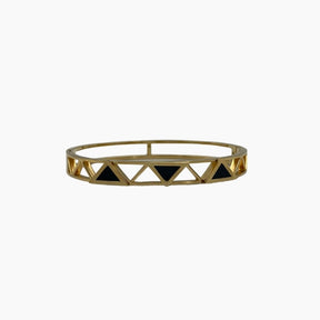 Gold bracelet with black triangle accents 
