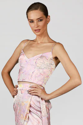 Model wearing a pink floral top