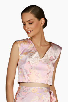 Woman wearing a sleeveless floral top 