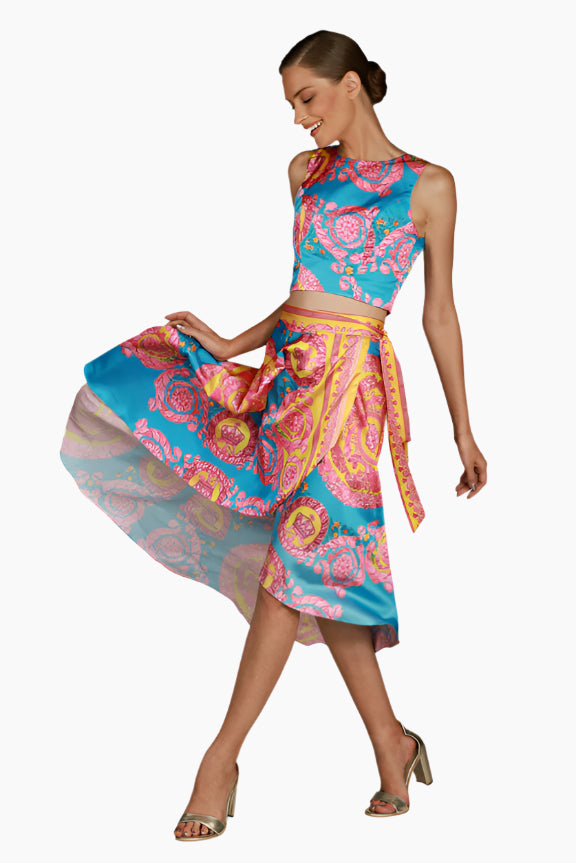 Woman wearing a colorful patterned outfit, Flow wrap design with matching sleeveless top
