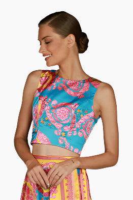Woman wearing a colorful top sleeveless with a matching skirt