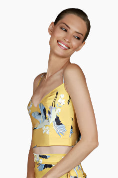 Woman wearing a yellow floral dress 