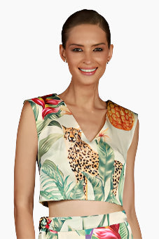 Woman wearing a sleeveless top with a leopard and floral pattern