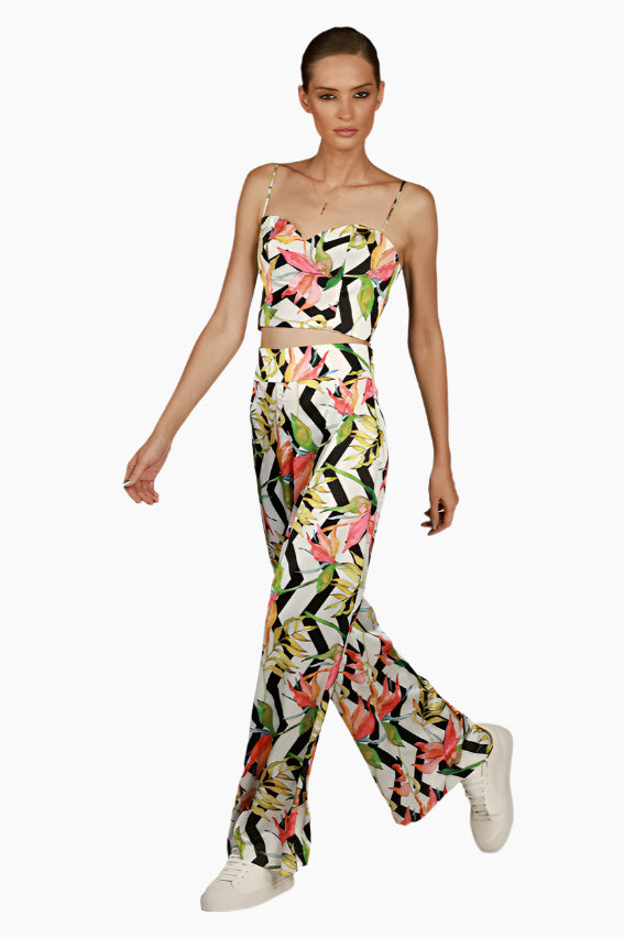 Woman wearing a colorful floral pants with matching top