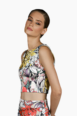 Person wearing a floral sleeveless top with a matching skirt