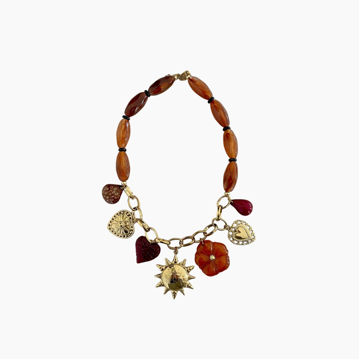 Bracelet with wooden beads and gold charms on a white background