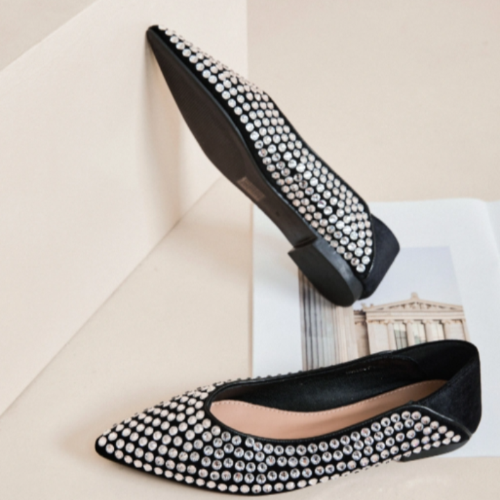 Black pointed-toe flats with pearl embellishments 