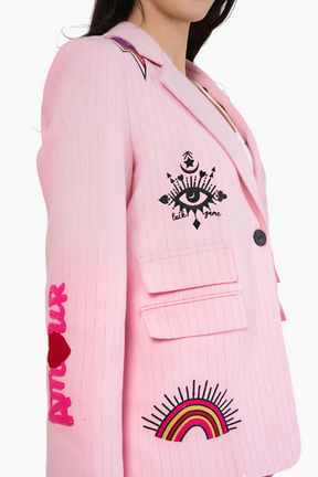 Pink blazer with eye and rainbow designs
