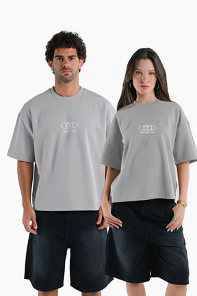 Two people wearing matching gray t-shirts