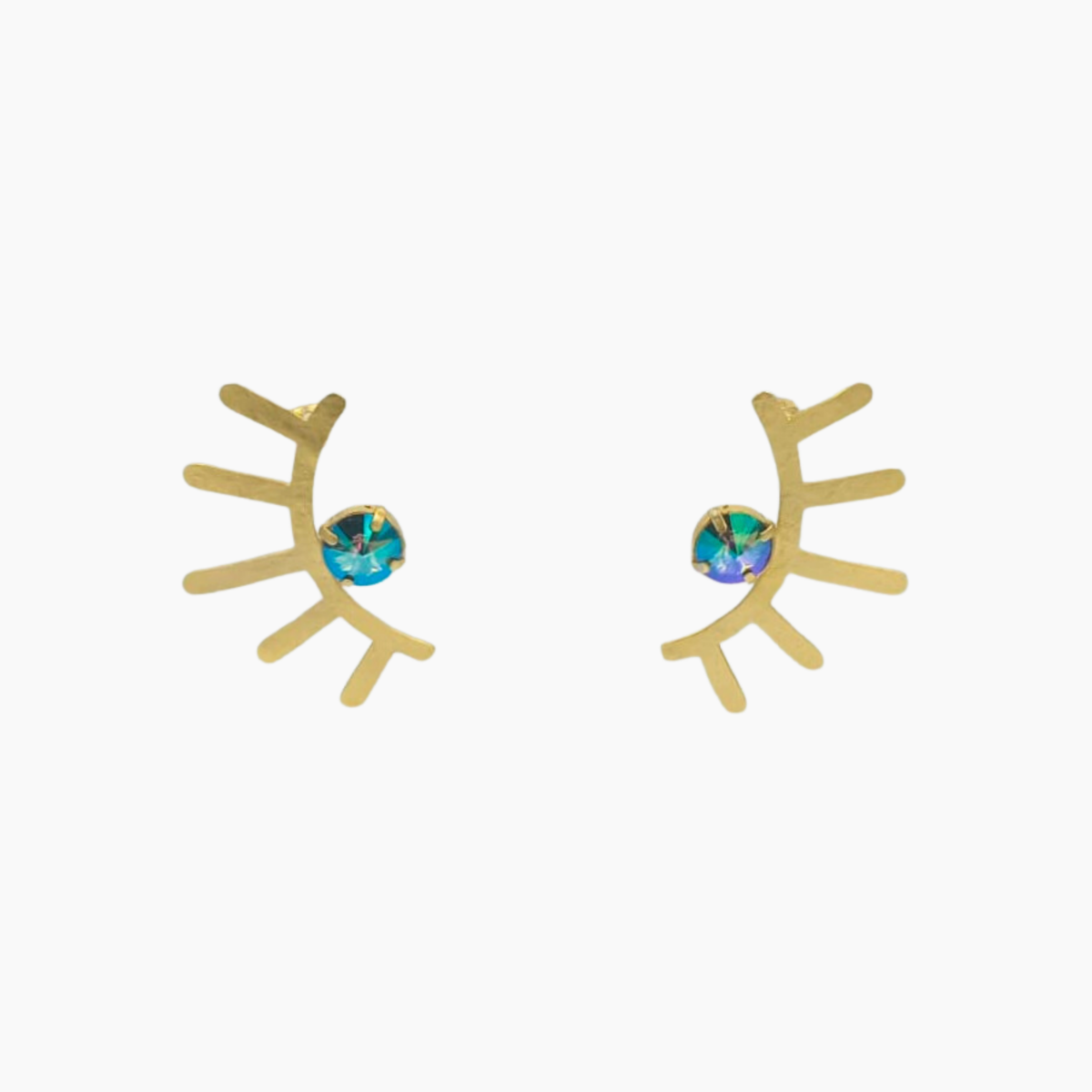Gold eyelash-shaped earrings with gemstone centers on a white background