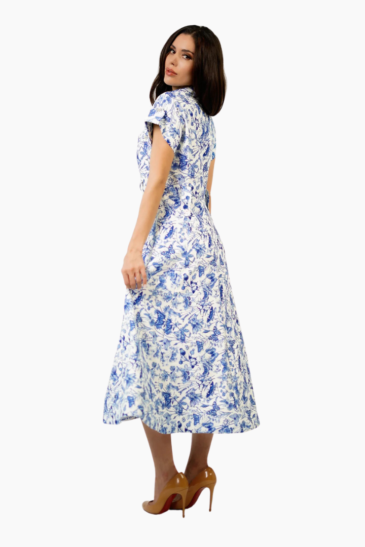 Woman wearing a floral dress on a white background
