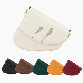 Set of five small leather pouches in different colors on a white background