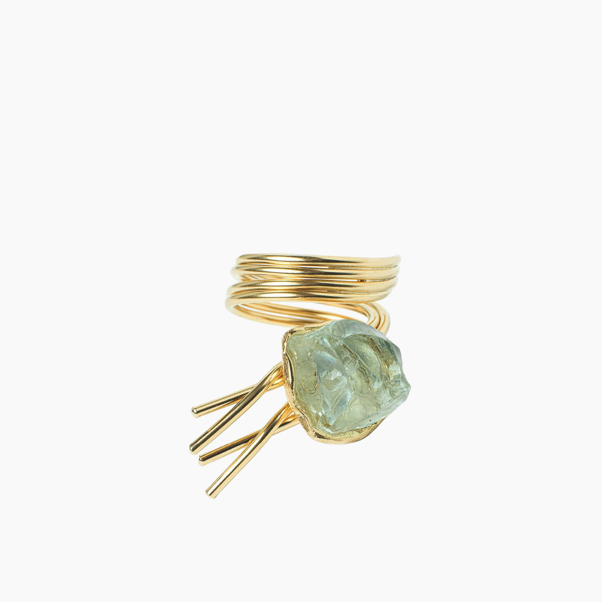 Gold ring with a green stone on a white background