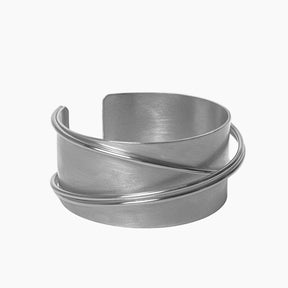 Silver metal cuff bracelet on a white background