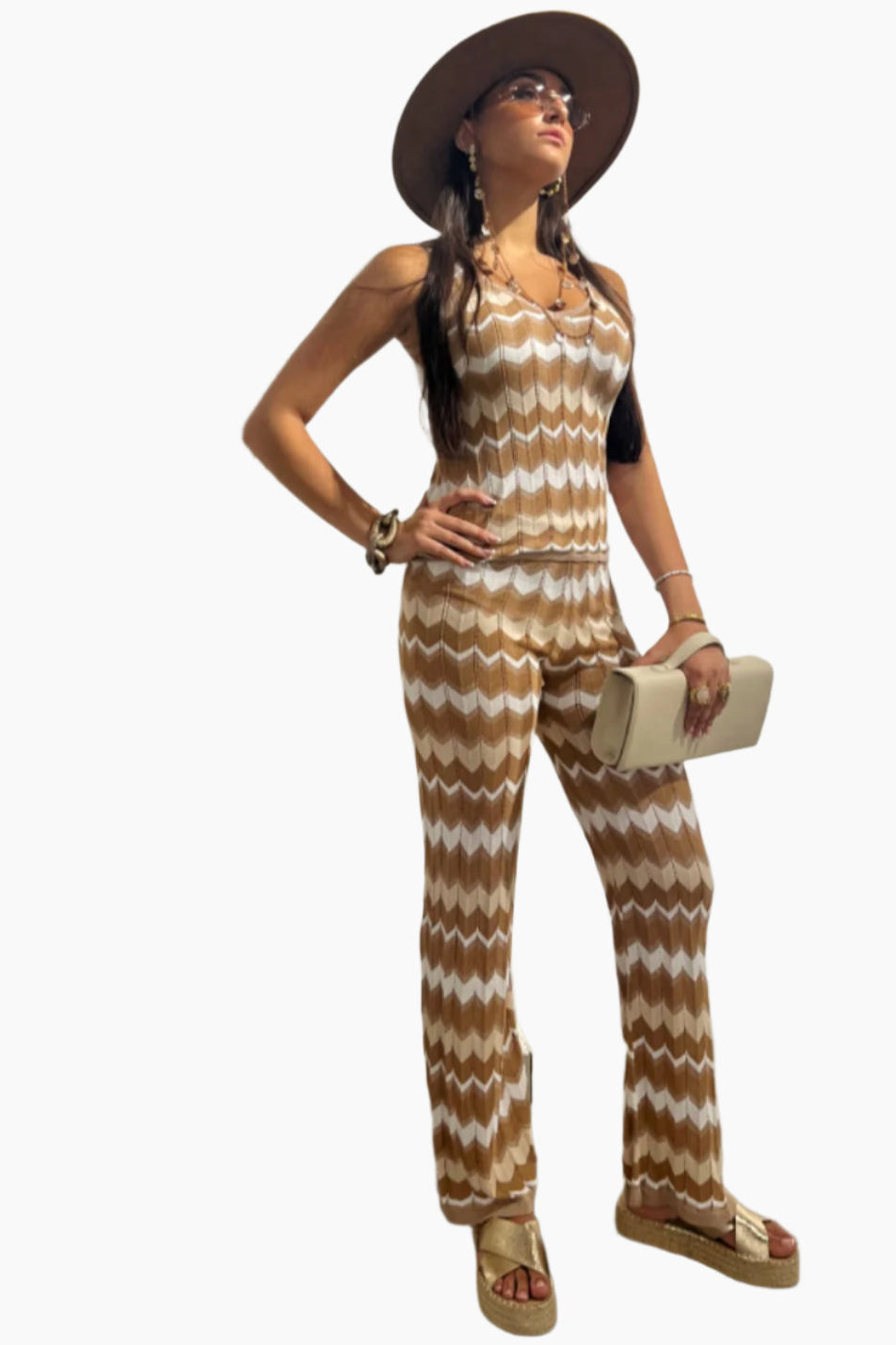model wearing viscose set , top and pants same brown and white pattern