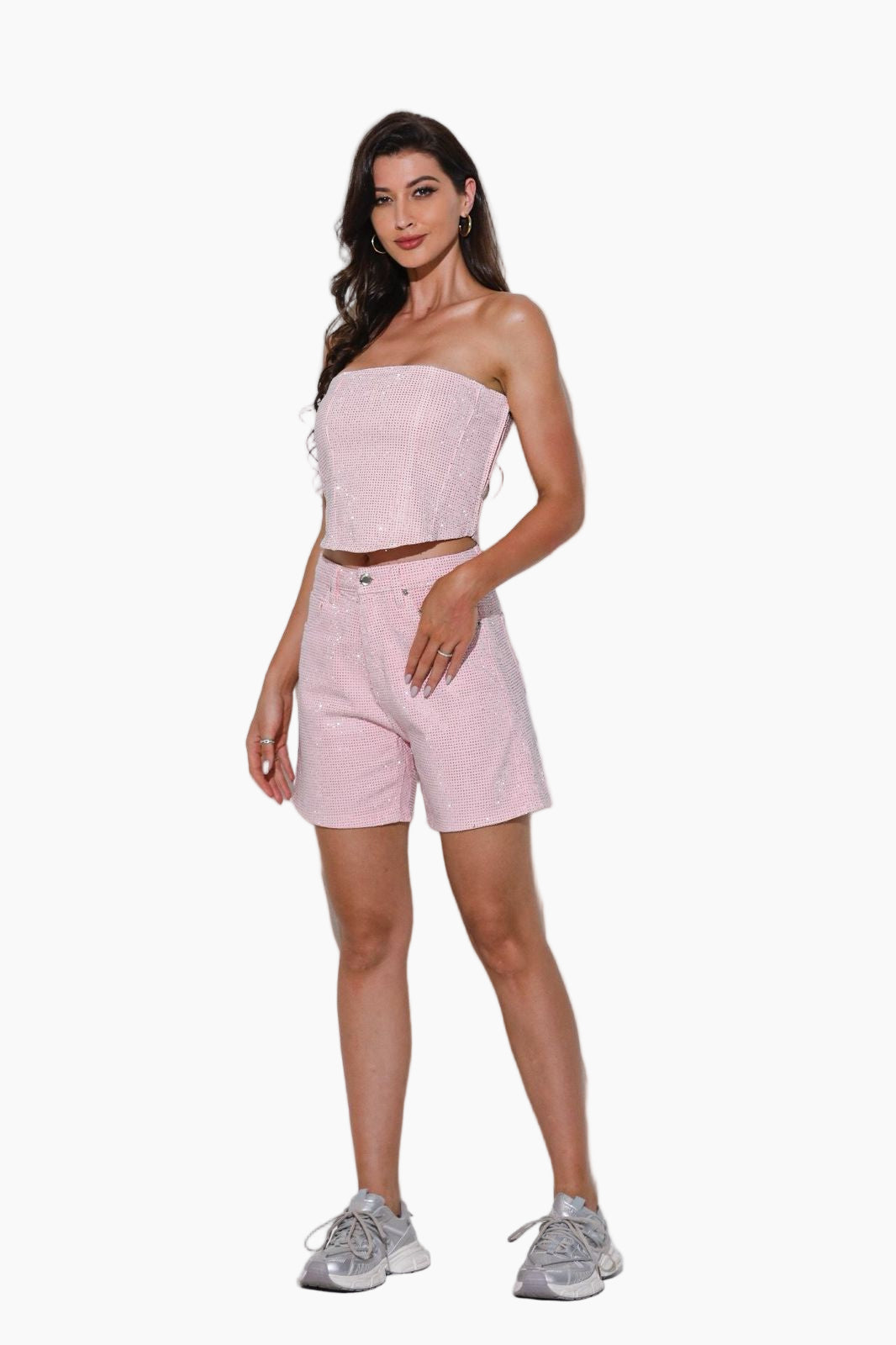 Woman wearing a strapless pink top and matching pants 