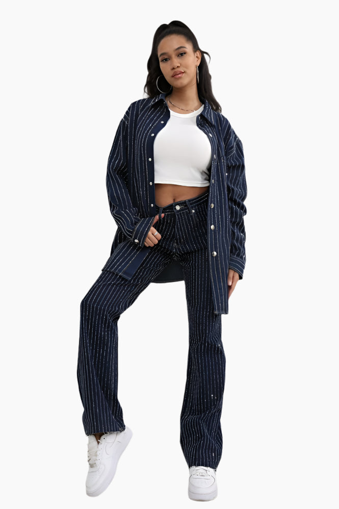 Woman wearing a navy pinstripe outfit with a white top 