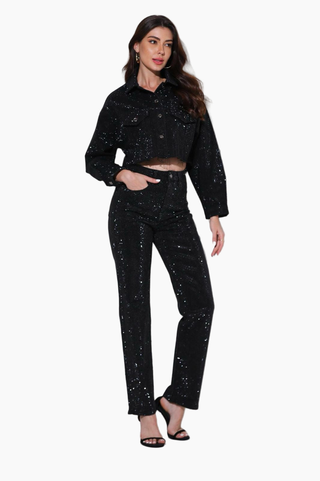 Woman wearing a black sequin outfit on a white background