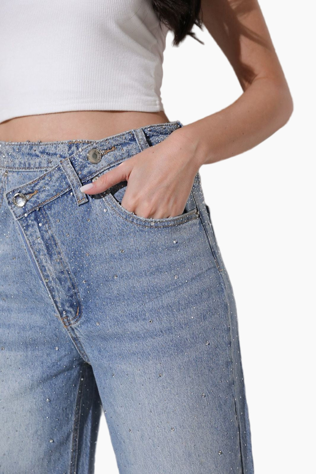Close-up of blue jeans with a white background