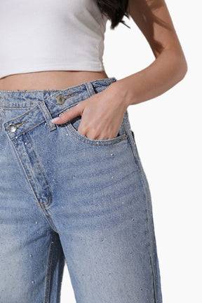 Close-up of blue jeans with a white background