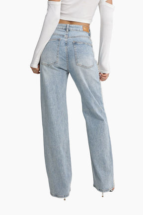 Light blue jeans worn by a person 