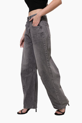Person wearing gray wide-leg jeans 