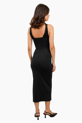 Woman wearing a black sleeveless dress 