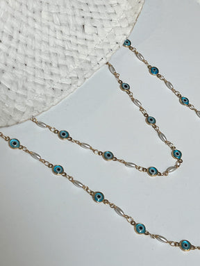 White straw hat with devil eye chains