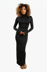 Woman wearing a black long-sleeve dress 