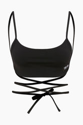Feminine black top featuring a long rope back for a customizable look. Perfect for both daywear and a night out.
