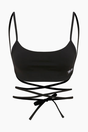 Feminine black top featuring a long rope back for a customizable look. Perfect for both daywear and a night out.