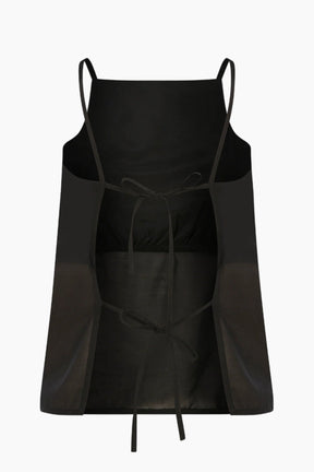 Voile top featuring an inner breast lining for coverage and adjustable back straps for a tailored fit.