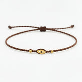 brown eye bracelet, Handmade 925 sterling silver bracelet, Gold plated in 24k with handmade wax cord braid and zircon.
Adjustable closure and size.