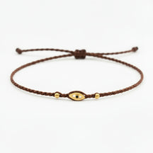 brown eye bracelet, Handmade 925 sterling silver bracelet, Gold plated in 24k with handmade wax cord braid and zircon.
Adjustable closure and size.