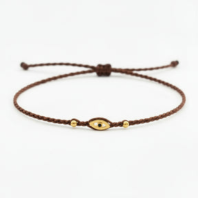 brown eye bracelet, Handmade 925 sterling silver bracelet, Gold plated in 24k with handmade wax cord braid and zircon.
Adjustable closure and size.