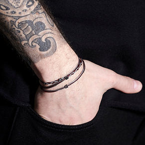 Handmade Sterling Silver 925 Bracelet with wax cord and silver square elements.