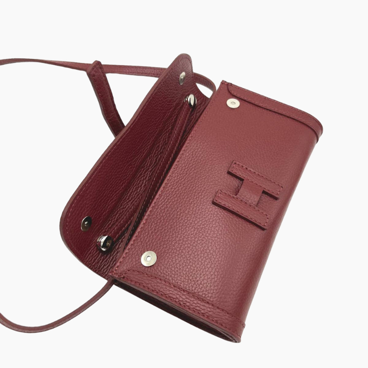 Maroon leather crossbody bag with visible brand logo on